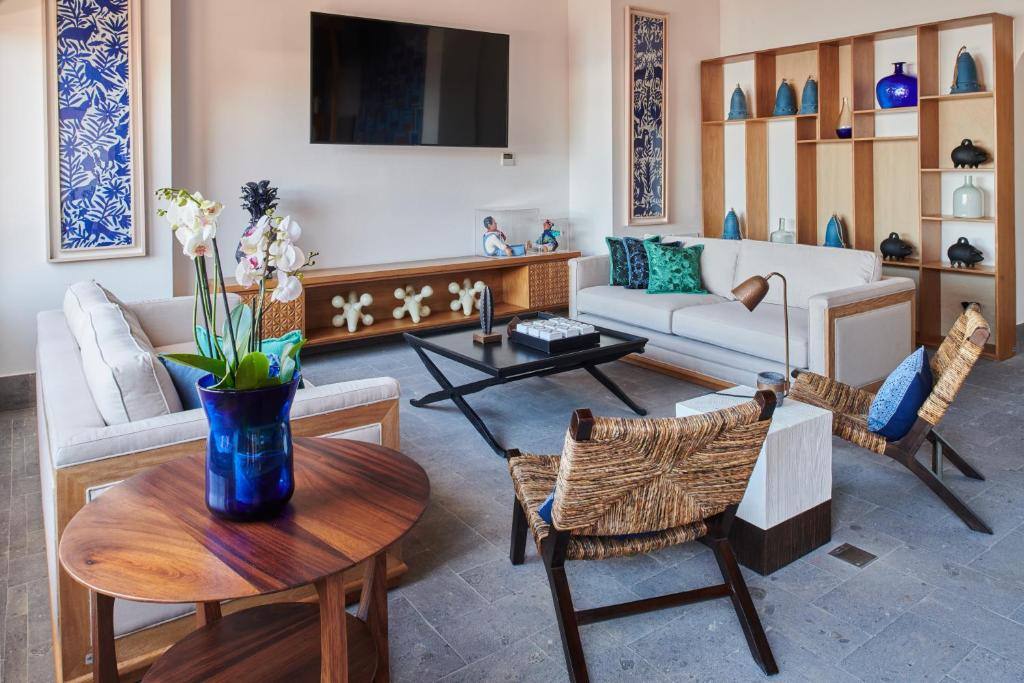 Patio Azul Hotelito Boutique: Shared lounge/TV area